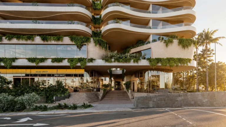 Curved podium and landscaping beside Kingsford Smith Drive
